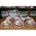 A ROYAL ALBERT SERENA TEASET, comprising cake plate (hairline), milk jug, sugar bowl, six teacups,