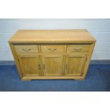 A PARTIALLY SOLID GOLDEN OAK SIDEBOARD, three short over three long drawers, width 131cm x depth