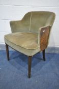 AN ART DECO ARMCHAIR, covered in green velour upholstery, with burr walnut panel to outer front edge
