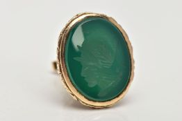 A 9CT GOLD INTAGLIO FOB, a large oval fob detailing a floral and foliage pattern, a green chalcedony