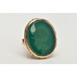 A 9CT GOLD INTAGLIO FOB, a large oval fob detailing a floral and foliage pattern, a green chalcedony