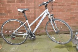 AN APOLLO CAFE LADIES MOUNTAIN BIKE with front suspension , 21 speed twist grip Shimano gears and