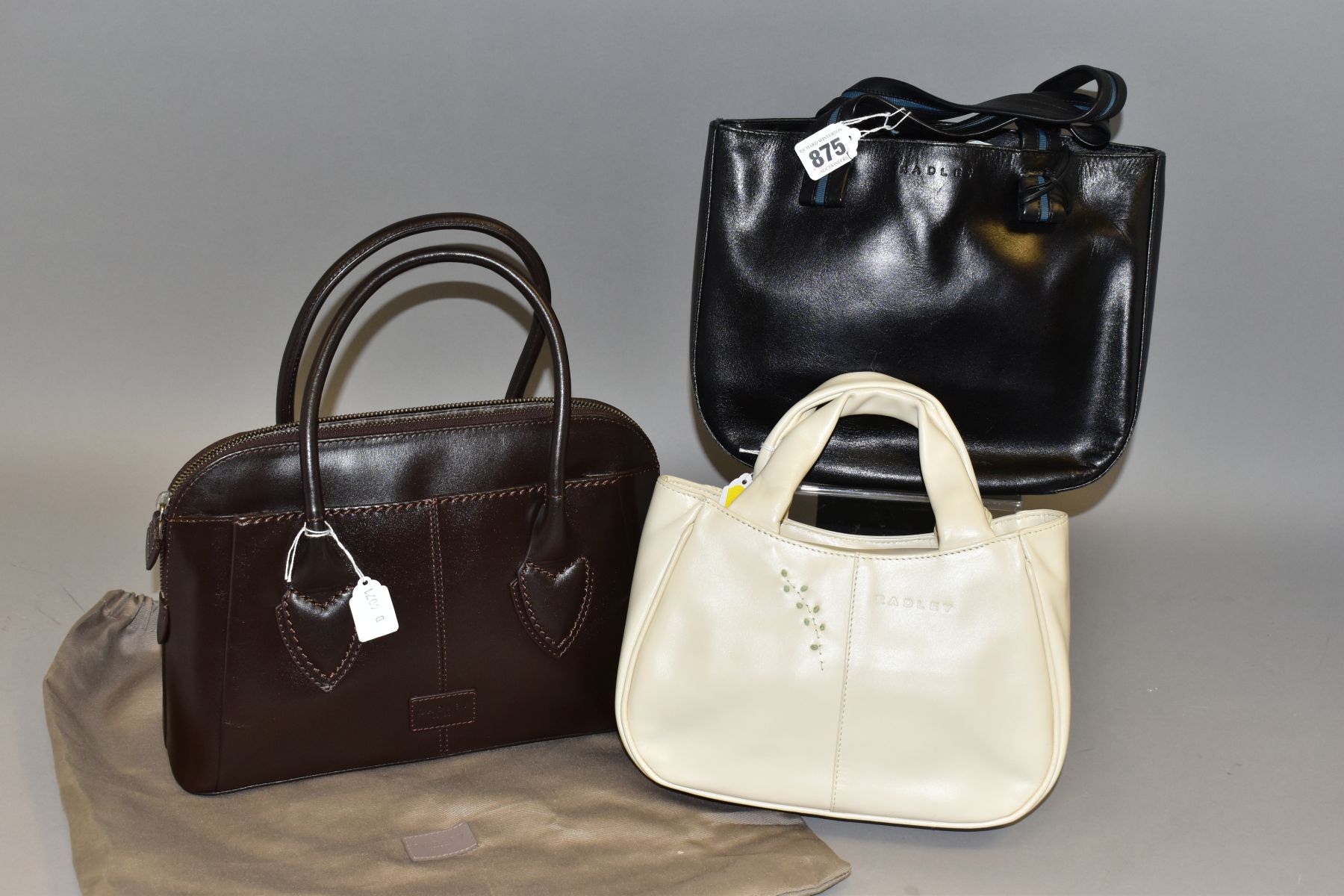 THREE RADLEY HANDBAGS, comprising a cream leather bag with stitched outlines of doves and olive