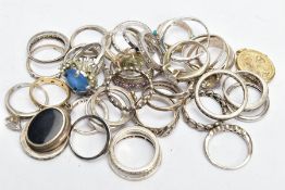 A BAG OF ASSORTED WHITE METAL RINGS, to include two silver rings a band hallmarked silver Sheffield,