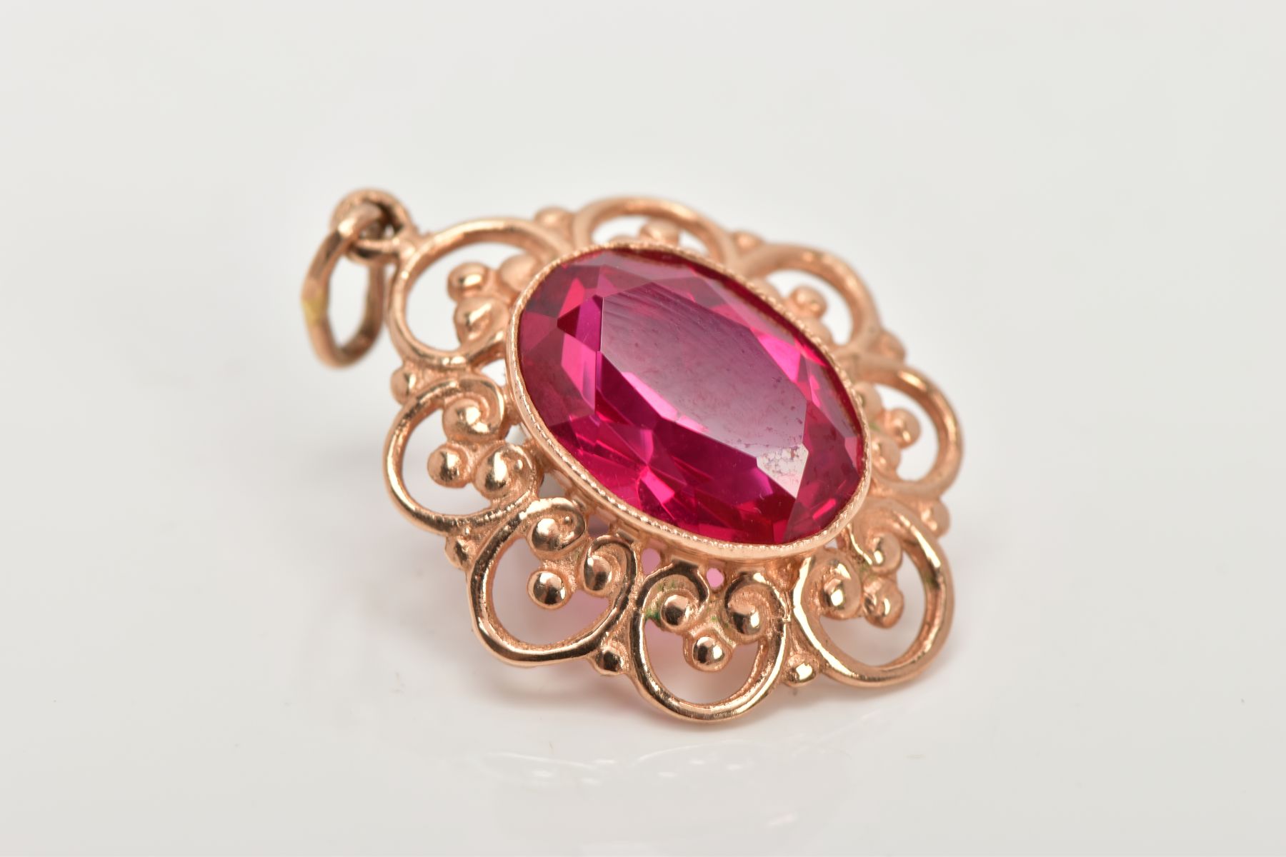 A YELLOW METAL SYNTHETIC RUBY PENDANT, designed with a central oval cut synthetic ruby, - Image 3 of 5