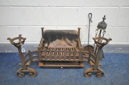 A CAST IRON FIRE GRATE, with adjoining andirons, and some other metal fire accessories