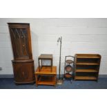 AN OAK OPEN BOOKCASE, an oak three tier cake stand, brassed standard lamp, yew wood corner