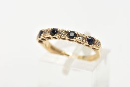 A 9CT GOLD SAPPHIRE AND DIAMOND HALF ETERNITY RING, designed with four circular cut deep blue