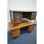 A MID CENTURY TEAK KNEE HOLE DESK, with five various drawers and two brushing slides, width 152cm