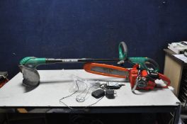 A VINTAGE HOMELITE XL1 AUTOMATIC PETROL CHAINSAW with 2 spare blades (engine pulls freely but hasn't