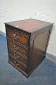 A MAHOGANY TWO DRAWER FILING CABINET, with red leather writing surface and brushing slide with