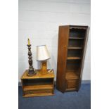 AN OAK OPEN BOOKCASE, with canted corner, over a single cupboard door base, width 82cm x depth
