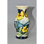 A MOORCROFT POTTERY PANSY PARADE BALUSTER VASE, having tubelined yellow and purple pansies on a