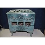 A MIRUS OF PARIS CAST IRON STOVE, French antique, enamelled in green (some damage and rust to the