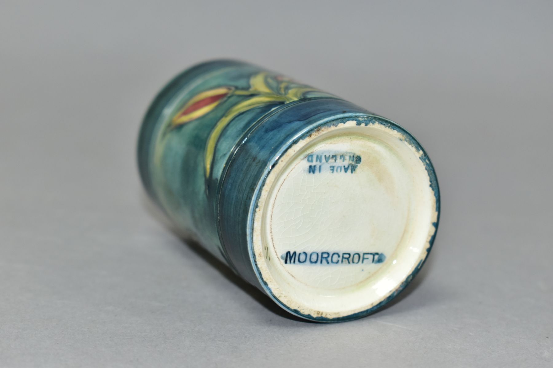 A MOORCROFT POTTERY CYLINDRICAL VASE, banded and decorated with tube lined Freesias on a blue - Image 6 of 6