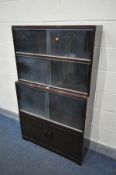 A MINTY MAHOGANY FOUR SECTION BOOKCASE, the top three sections with glazed doors, the bottom section