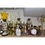 A COLLECTION OF LATE 19TH AND 20TH CENTURY OIL LAMPS, MODERN CANDLEHOLDERS, WOODEN, METAL AND