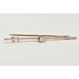 A DIAMOND BAR BROOCH, a single old cut diamond, approximate total carat weight 0.25ct, prong set