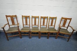 A SET OF SIX ARTS AND CRAFTS OAK AND INLAID DINING CHAIRS, with a splat back, including two carvers