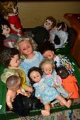 TWO BOXES OF DOLLS AND A DOLLS BED, fourteen twentieth century dolls to include a composite doll