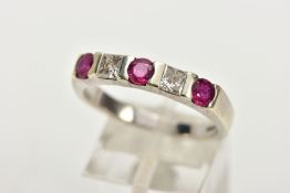 A 9CT WHITE GOLD RUBY AND DIAMOND RING, half eternity ring set with three circular cut rubies,