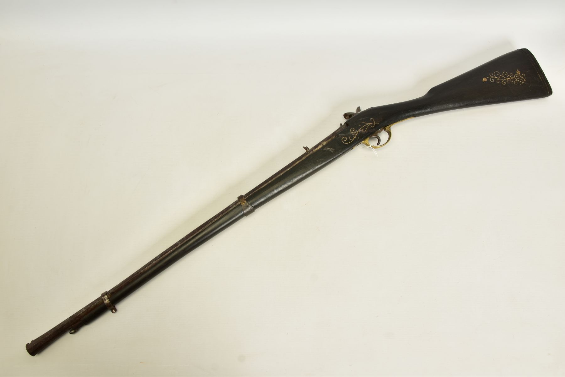 A PERCUSSION RIFLE, made in a native armoury of inferior quality and in poor condition, its 30”