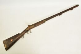 AN ANTIQUE 12 BORE SINGLE BARREL PERCUSSION SHOTGUN, its metal surfaces are heavily rusted, and