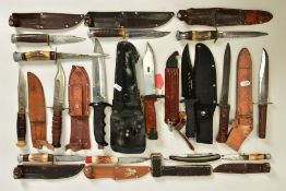 A MIXTURE OF SHEATH KNIVES MAINLY WITH LEATHER SHEATHS, a cut throat razor, lock knives and two
