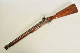 AN ANTIQUE SMOOTH BORE PERCUSSION CARBINE, fitted with a 21'' barrel in approximately 14 bore, it is