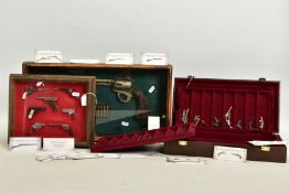 A THREE TIER CASE COVERED WITH SIMULATED LEATHER CONTAINING THE 'LEGENDARY GUN COLLECTION' BY