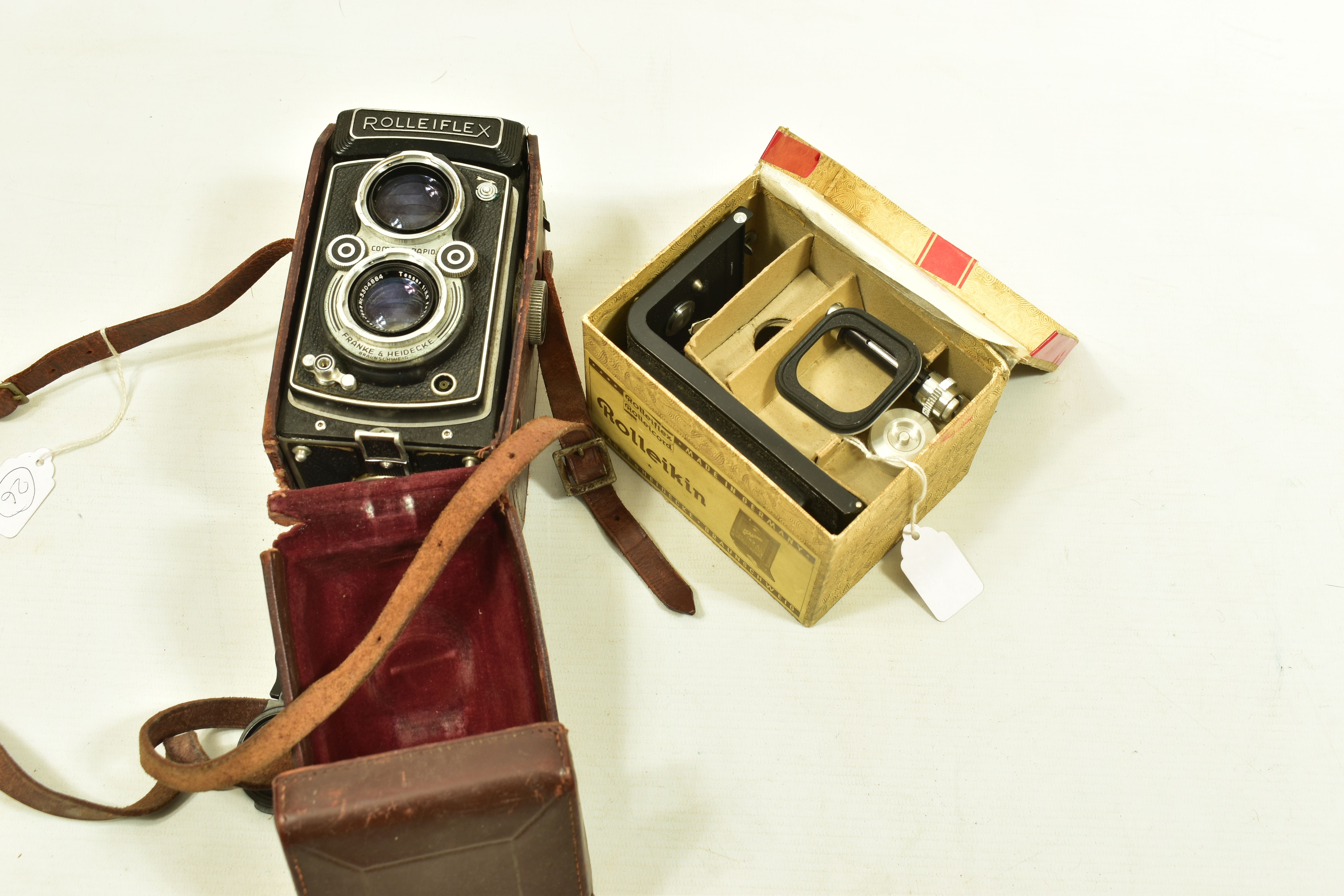A ROLLEIFLEX AUTOMAT 6X6 K4 50 TLR CAMERA Serial No 1166151 fitted with Tessar 7.5cm f 3.5 with a