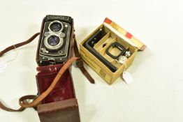 A ROLLEIFLEX AUTOMAT 6X6 K4 50 TLR CAMERA Serial No 1166151 fitted with Tessar 7.5cm f 3.5 with a