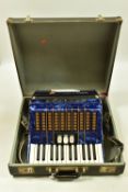 A DELICIA JUNIOR 2 PIANO ACCORDION in Pearloid Blue with 48 buttons and 26 keys , 3 tone buttons,