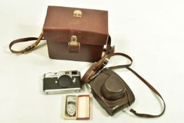 A LEICA M2 FILM CAMERA Serial No 976119 fitted with an Elmar 50mm f2.8lens Serial no 1980377 and