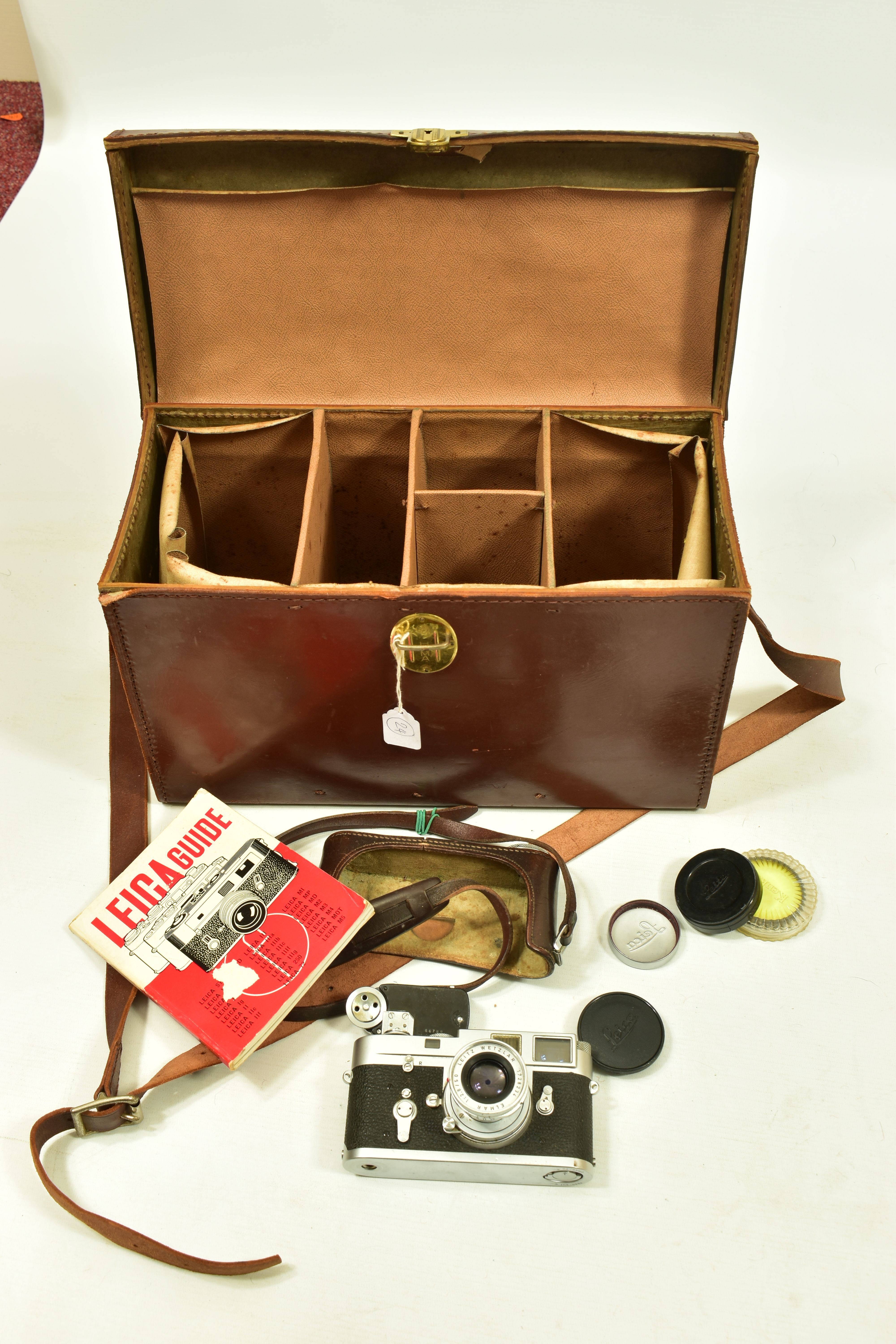 A LEICA M2 FILM CAMERA Serial No 1004152 fitted with an Elmar 50mm f2.8 lens Serial no 1728234 (