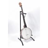 AN ASHBURY OPEN BACKED 5 STRING BANJO with walnut neck and sides, gold coloured Mother of pearl star