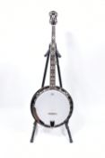 AN ASHBURY BLUE GRASS FIVE STRING BANJO with mahogany back, sides and neck, a Rosewood