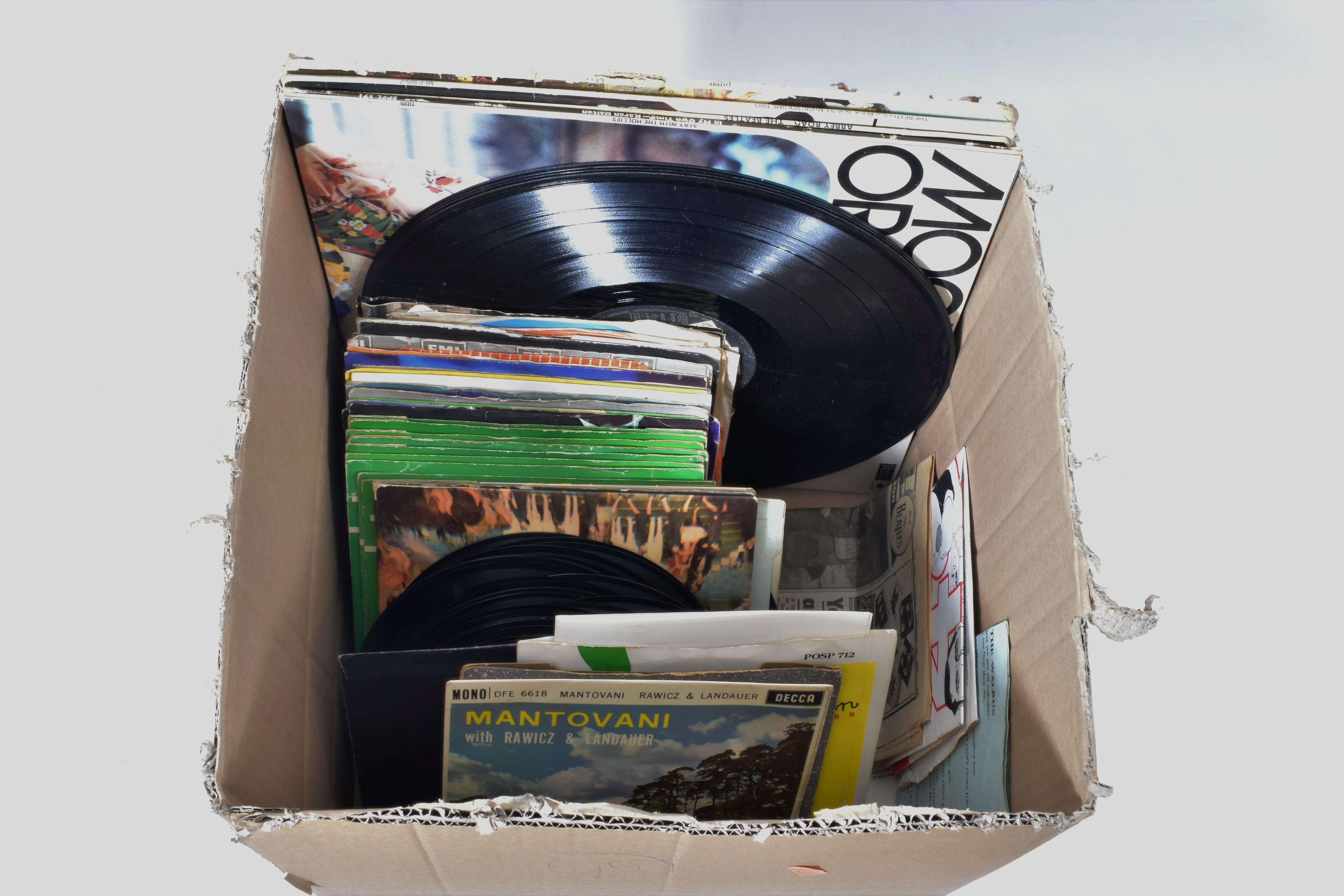 A TRAY CONTAINING OVER SEVENTY LPs, EPs AND SINGLES by artists such as The Beatles, John Lennon,