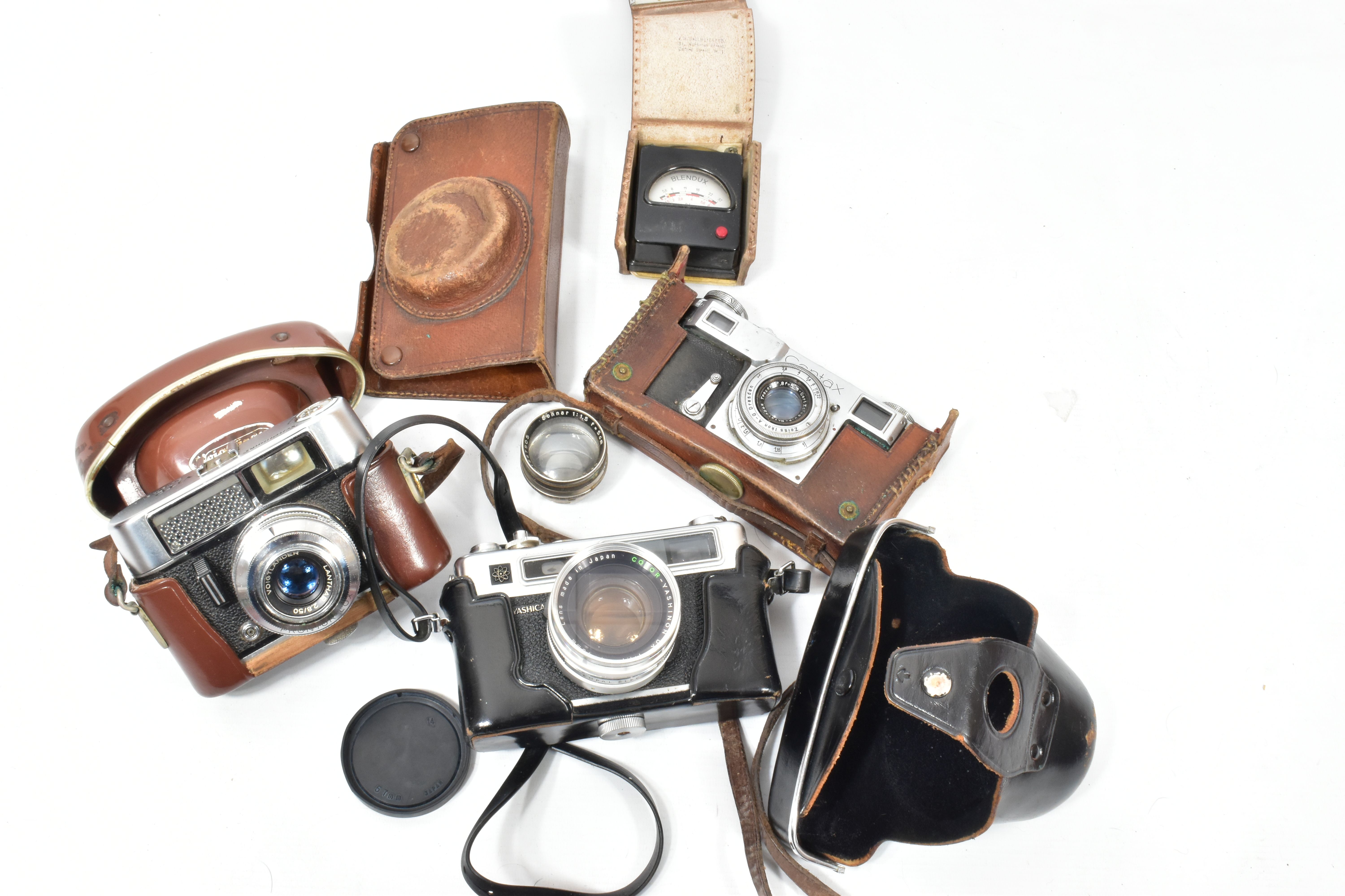 A ZEISS IKON CONTAX 2 SLR CAMERA fitted with a Carl Zeiss Jena Tessar 5cm f2.8 lens in tatty leather