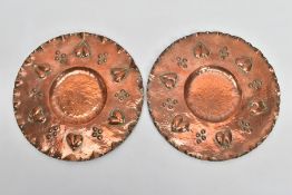 A PAIR OF ARTS & CRAFTS EARLY 20TH CENTURY COPPER CHARGERS, one stamped verso H**919, both measuring