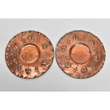 A PAIR OF ARTS & CRAFTS EARLY 20TH CENTURY COPPER CHARGERS, one stamped verso H**919, both measuring