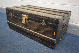 A VINTAGE WOODEN BOUND TRAVELLING TRUNK, with metal banding and twin handles, length 77cm x depth