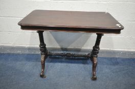 A LATE VICTORIAN MAHOGANY CENTRE TABLE, rectangular top with rounded corners, on turned supports