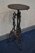 A CAST IRON COALBROOKDALE STYLE JARDINIERE STAND, the circular pierced top on an ornate base,