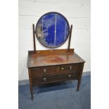 AN EDWARDIAN MAHOGANY AND INLAID DRESSING CHEST, with an oval mirror, and three drawers, width 107cm