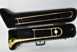 A BACH. U.S.A. TROMBONE in bras with chromed detailing, a Denis Wick, London 4BS mouthpiece and