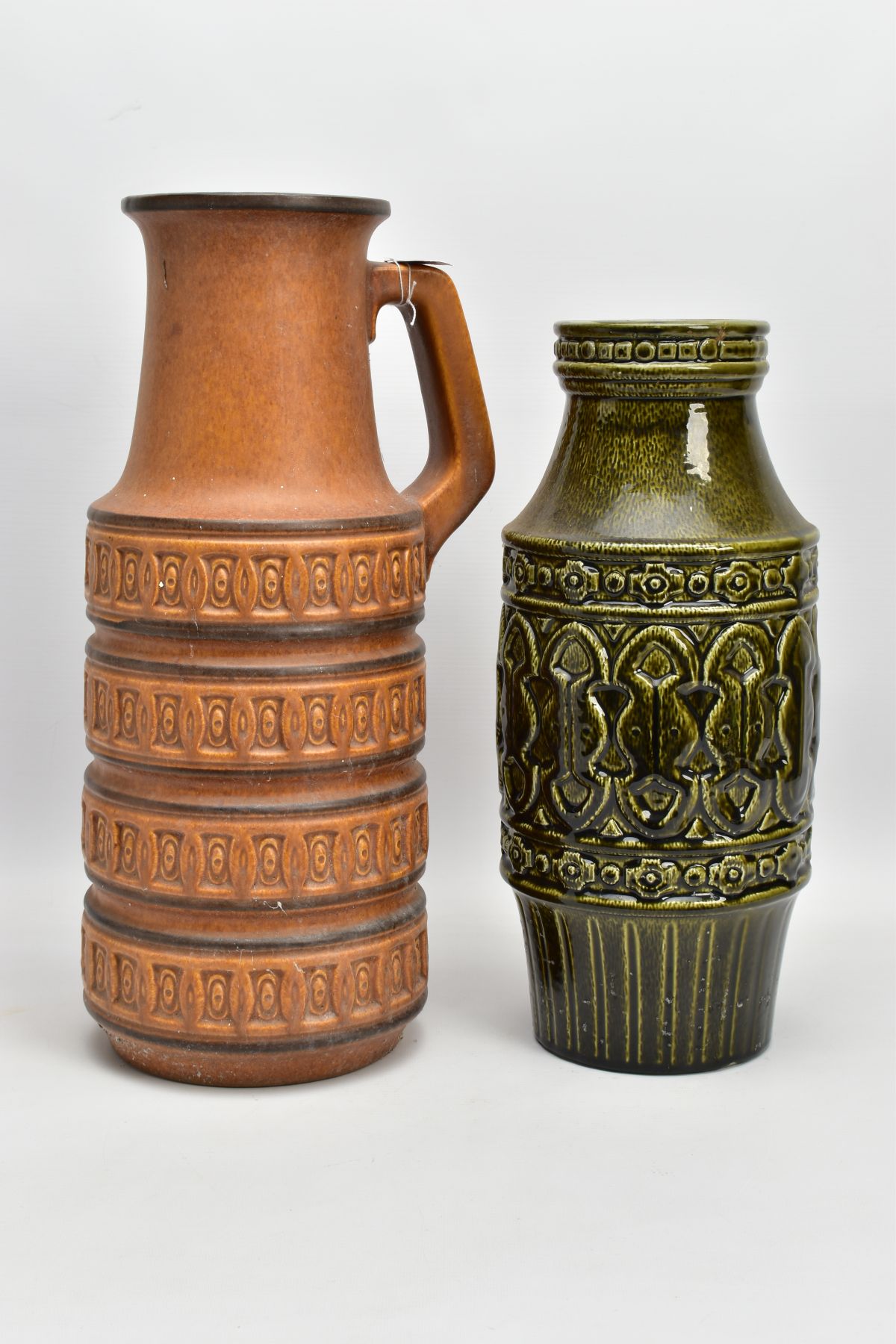 A WEST GERMAN POTTERY JUG WITH AN ART POTTERY VASE, the West German jug measuring 45cm high, being