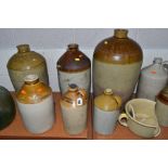 A QUANTITY OF STONEWARE JARS AND FLAGONS, etc, with two vintage bottle vases, the tallest flagon