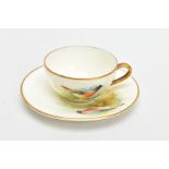 A ROYAL WORCESTER MINIATURE CUP AND SAUCER, the ivory ground painted with a Redstart to the cup