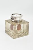 AN EDWARDIAN SILVER MOUNTED COMBINATION INKWELL AND POCKET WATCH STAND, the hinged circular cover